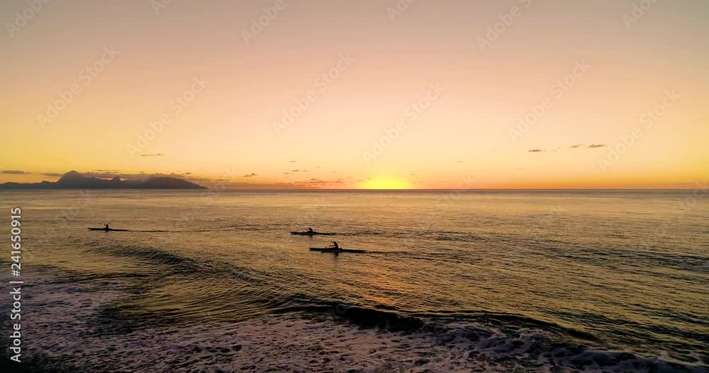 canoe and boat on a lagoon in French Polynesia (sunset) canoe and boat on a lagoon in French Polynesia (sunset)