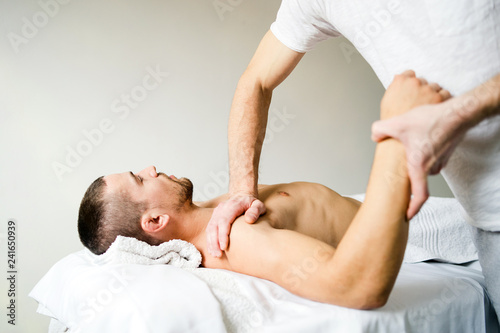 Fototapeta Naklejka Na Ścianę i Meble -  Shoulder sport Massage By Professional Therapist