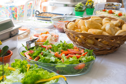 table of salads on a sunny day of party