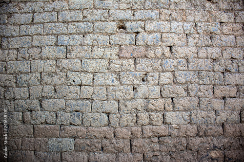 Adobe brick wall of an ancient house