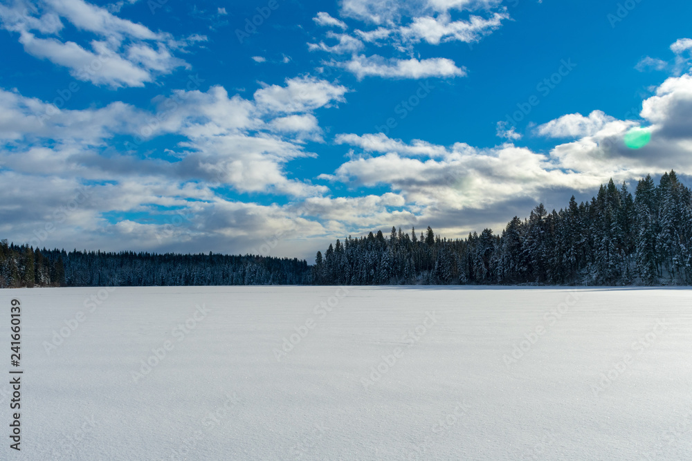 Sun Shines On Frozen Lake After Fresh Snowfall