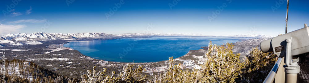 Aerial view of Lake Tahoe on a sunny winter day, Sierra mountains, California; far viewing eyepiece on the right side;