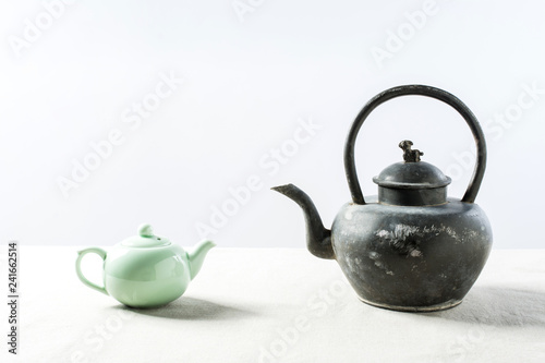 Now teapot and antique teapot
