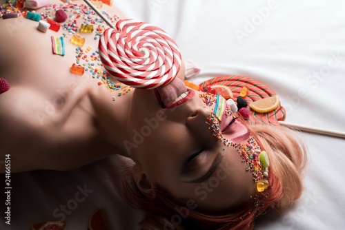 Blonde with sweets and caramel on her face shot
