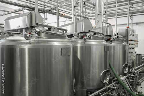 storage and pasteurization tank at the milk factory. equipment at the dairy plant
