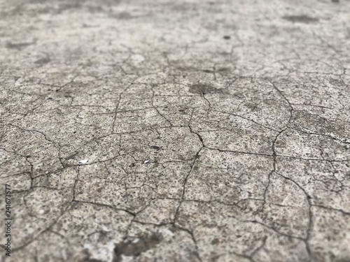 Dirty concrete floor with cracked 