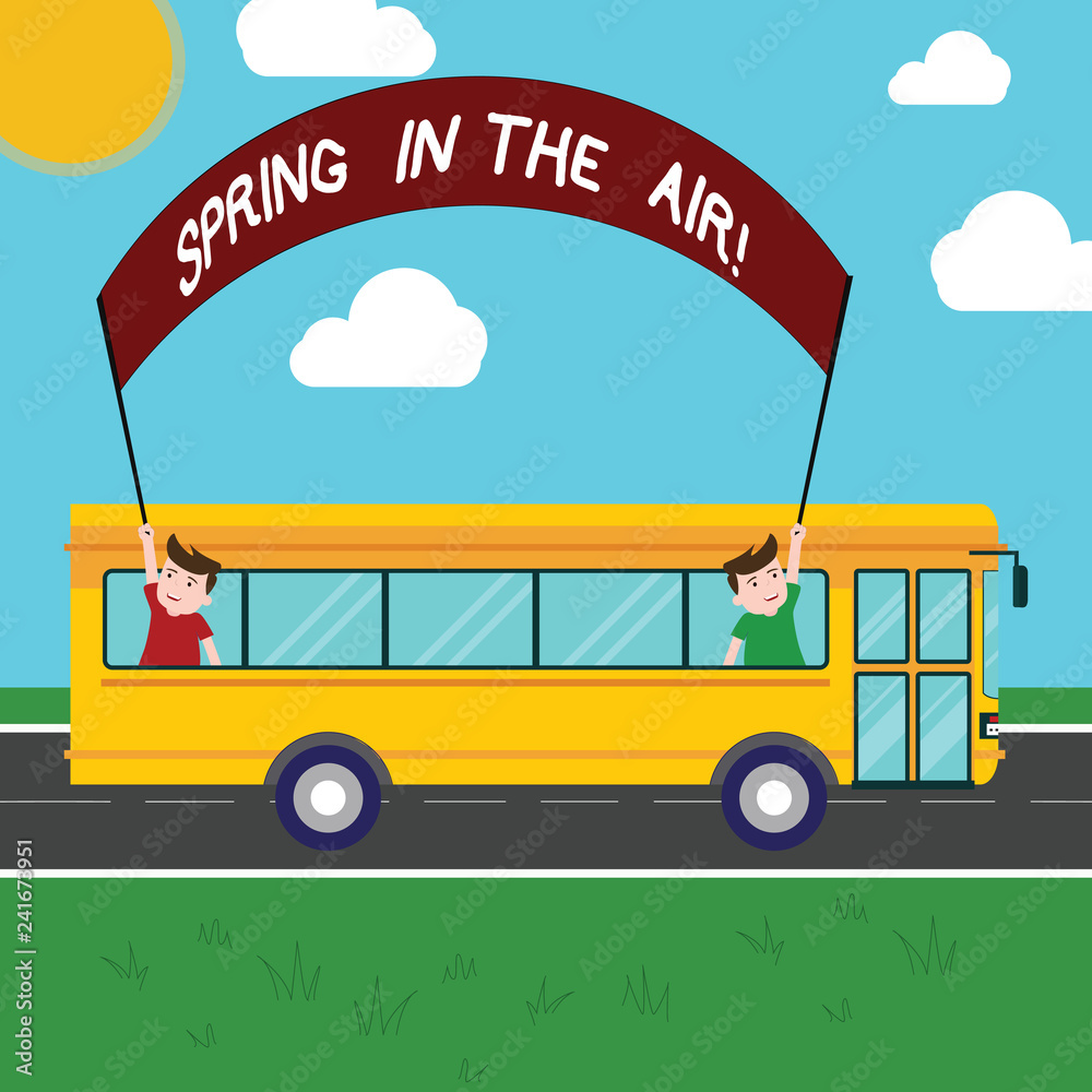 Handwriting text Spring In The Air. Concept meaning Natural feeling beautiful season flowers everywhere Two Kids Inside School Bus Holding Out Banner with Stick on a Day Trip