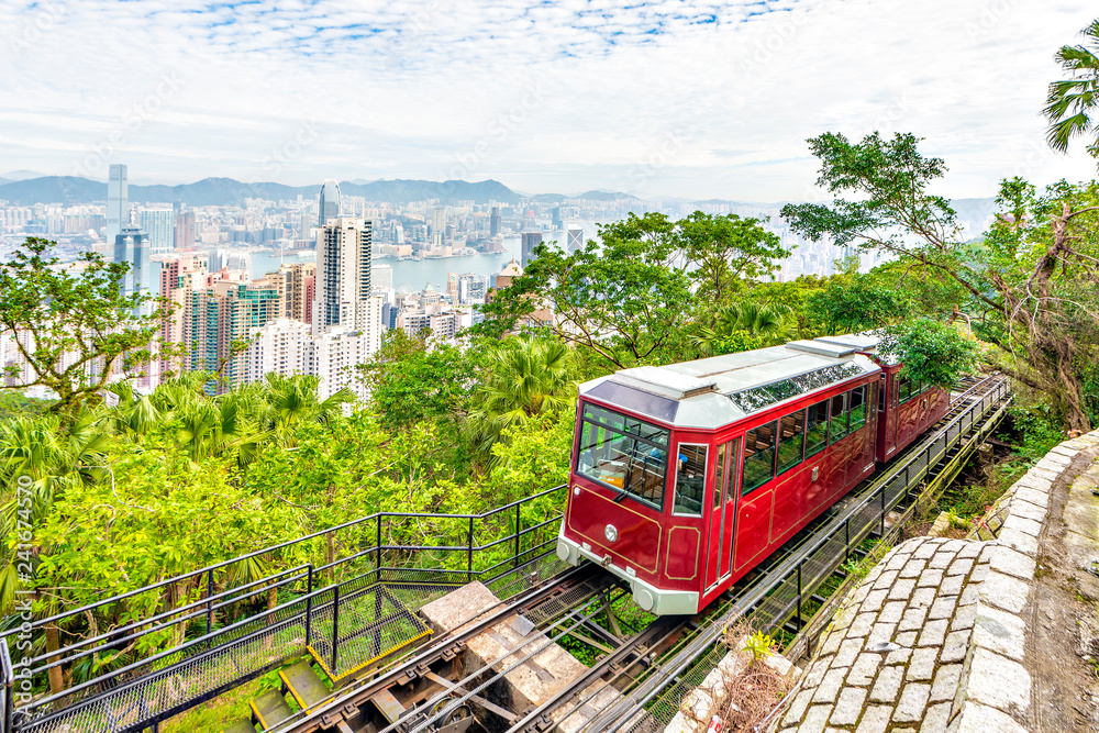 Naklejka premium Victoria Peak Tram and Hong Kong Skyscraper Buildings with Victoria Harbour Background, Hong Kong