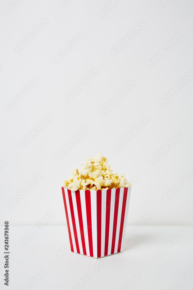 Full of popcorn in classic striped box Full of popcorn in classic striped box