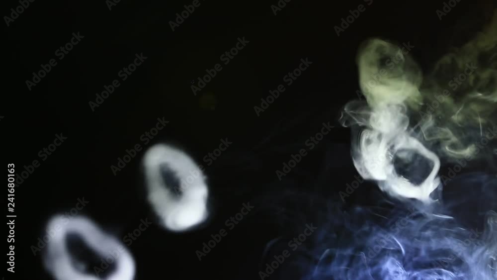 Smoke Rings Over Dark Background Created by Vaping