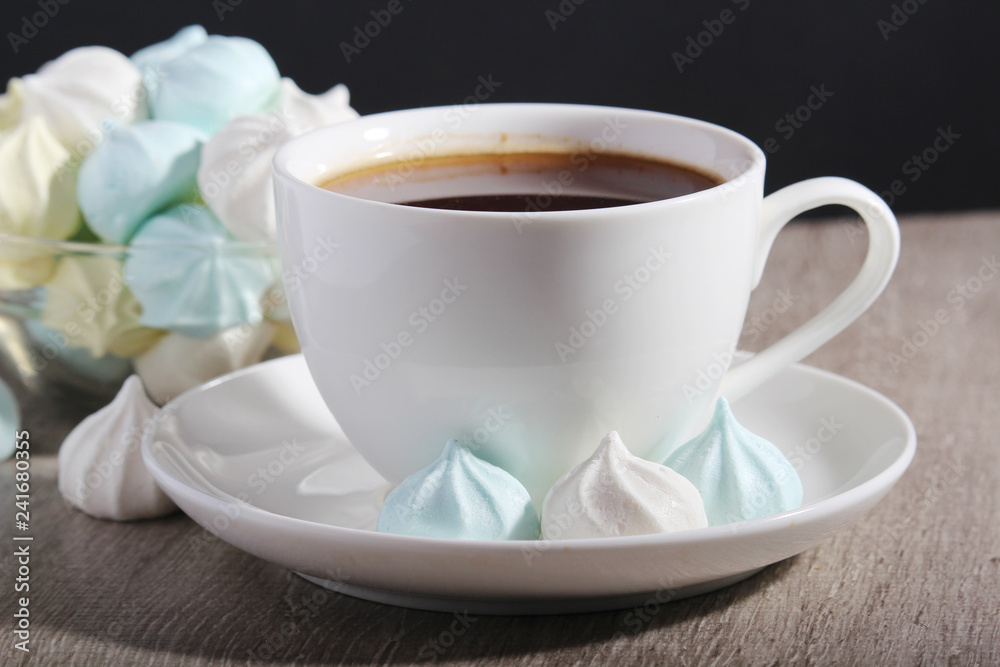 A cup of coffee and meringues for breakfast A cup of coffee and meringues for breakfast