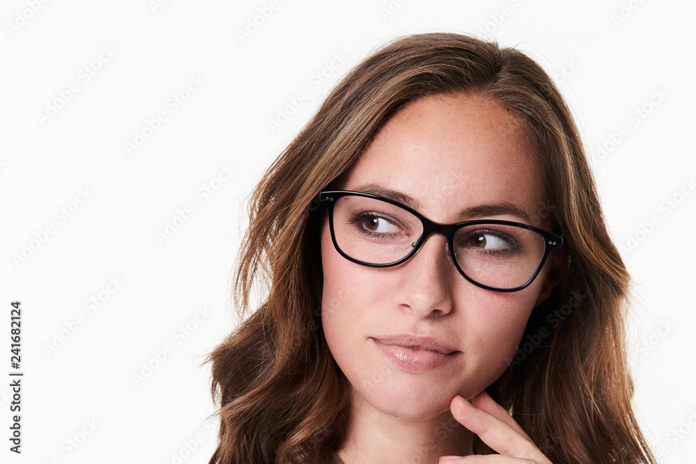 Thoughtful babe in spectacles, looking away