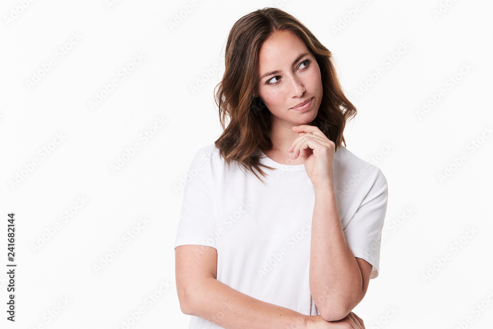 Thoughful young brunette in white t-shirt, studio Thoughful young brunette in white t-shirt, studio