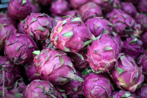 Group ripe red pitahaya fruit or dragon fruit on the local market of Hainan Island