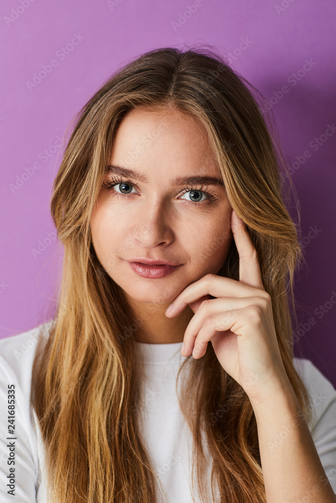 Young pretty girl against purple background Young pretty girl against purple background