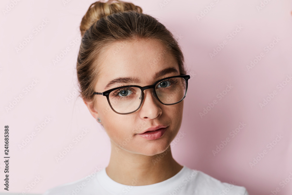 Clever girl in glasses against pink Clever girl in glasses against pink