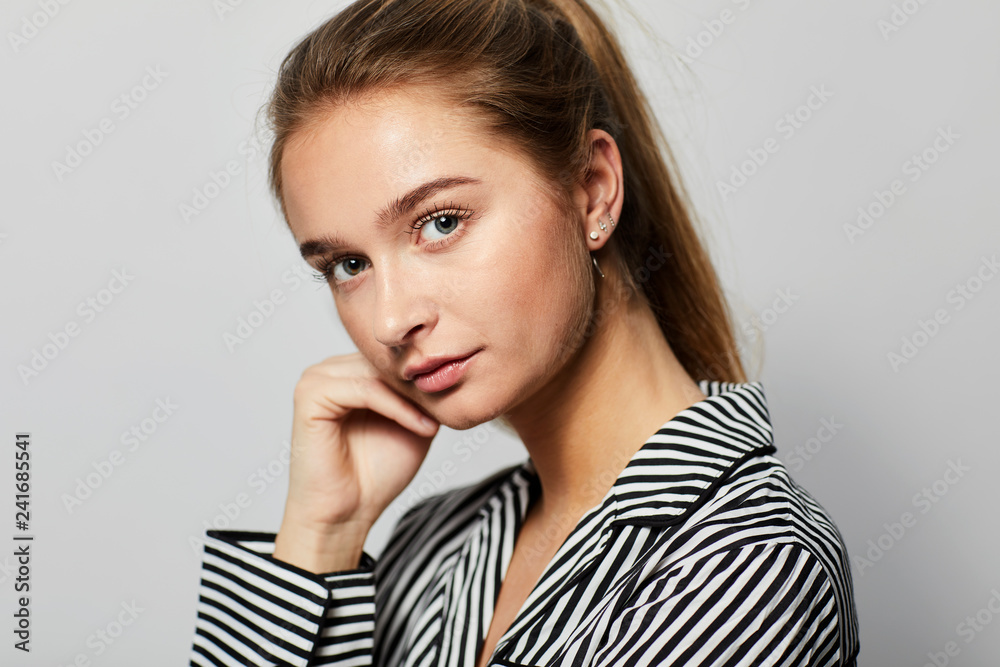 Pretty young woman in striped pajams, portrait Pretty young woman in striped pajams, portrait