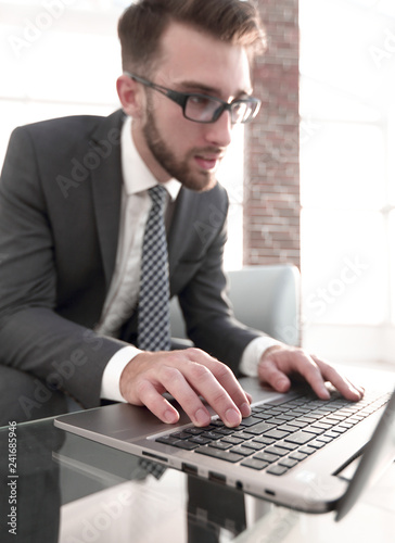 Portrait of successful businessman working in modern office