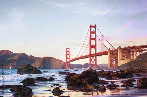 Sunset at Marshal's beach with Golden Gate bridge spectacular view. San Francisco, California.