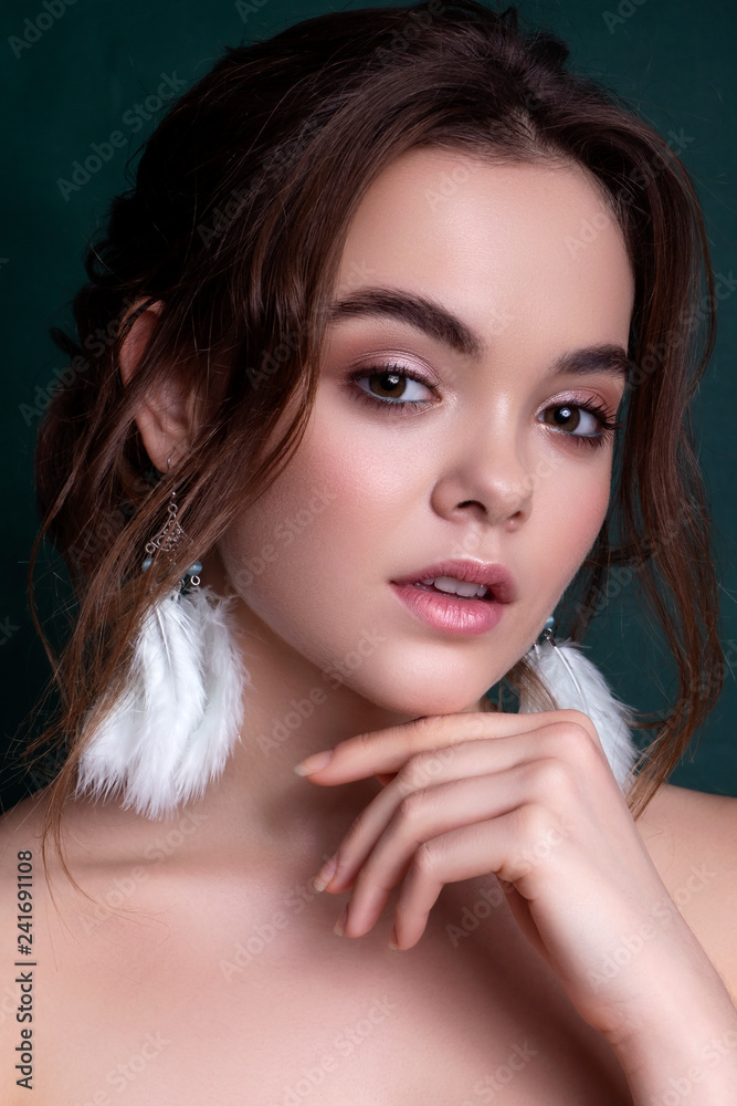 Cute smiling brunette caucasian woman with fresh, clean, healthy, flawless skin. Evening look with romantic hairstyle. Space for text Cute smiling brunette caucasian woman with fresh, clean, healthy, flawless skin. Evening look with romantic hairstyle. Space for text