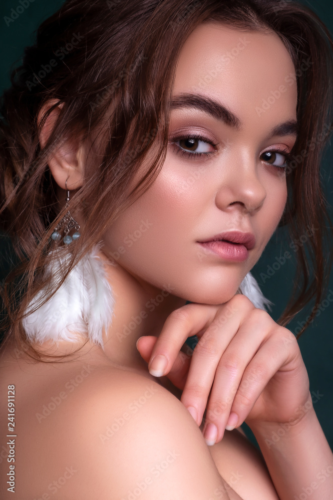Cute smiling brunette caucasian woman with fresh, clean, healthy, flawless skin. Evening look with romantic hairstyle. Space for text Cute smiling brunette caucasian woman with fresh, clean, healthy, flawless skin. Evening look with romantic hairstyle. Space for text