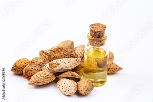 Almond oil on the white background. Organic herbal oil.
