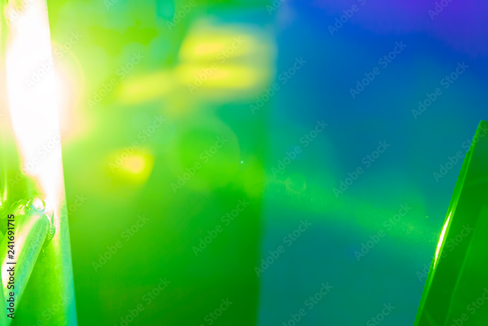 Abstract green and yellow background in blue spotlight