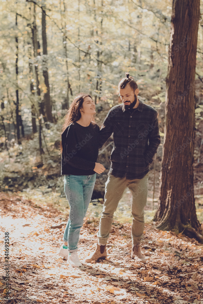 couple of lovers of people, husband and wife or a boy and girl during a date or walks in the woods couple of lovers of people, husband and wife or a boy and girl during a date or walks in the woods