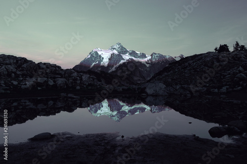 Mount Shuksan in autumn reflected at sunset