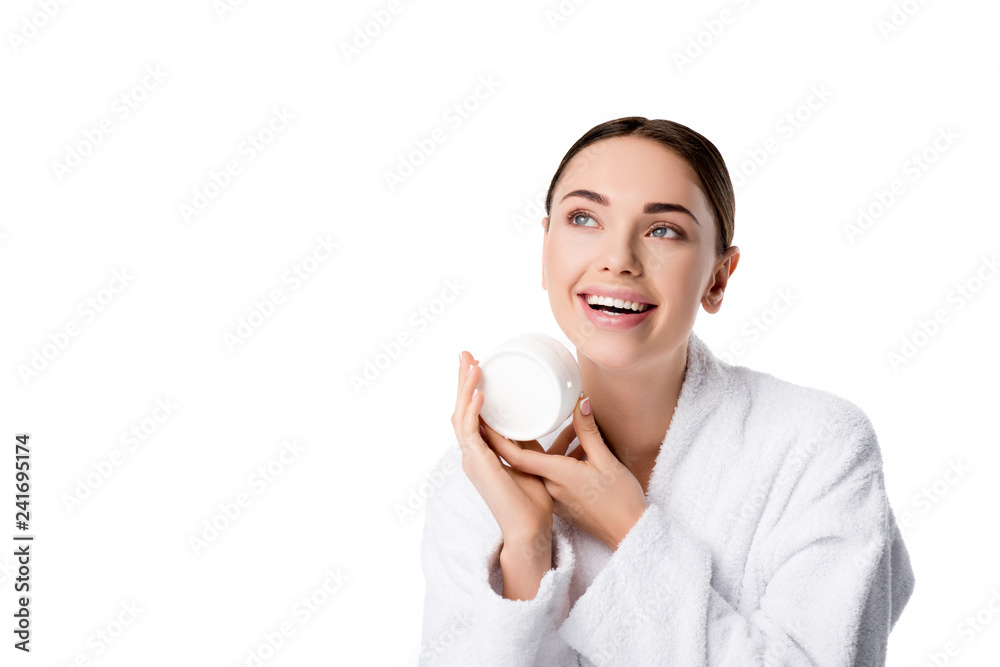 cheerful woman in bathrobe holding face cream isolated on white cheerful woman in bathrobe holding face cream isolated on white