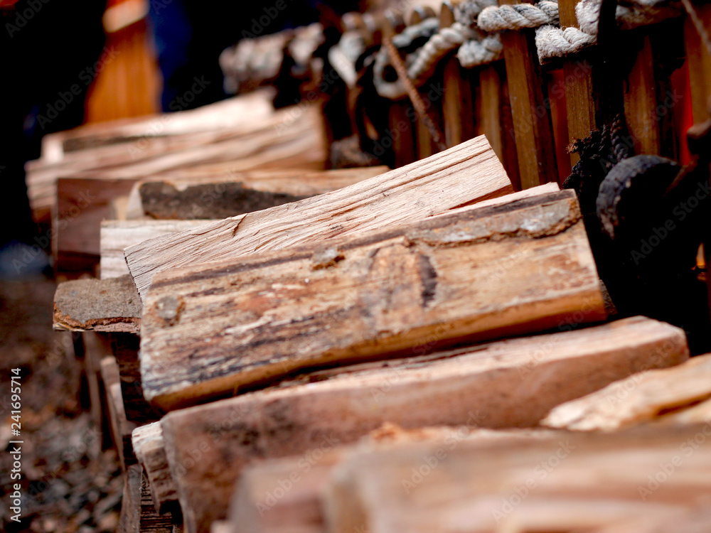 Fresh cut wood in a row with Bokeh effect Fresh cut wood in a row with Bokeh effect
