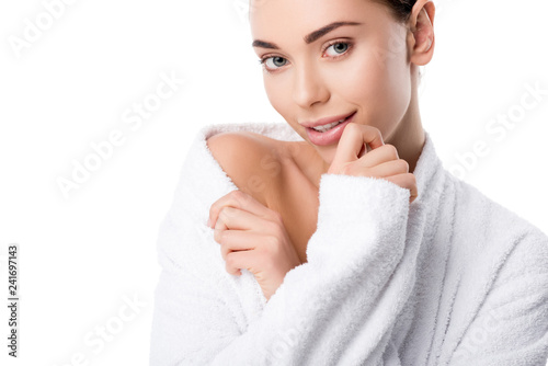 beautiful woman in bathrobe looking at camera isolated on white