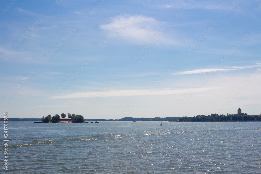 View of small islands in the Gulf of Finland near the city of Helsinki in Finland on a summer day. Travel by ferry to the island of Suomenlinna on the Gulf of Finland.