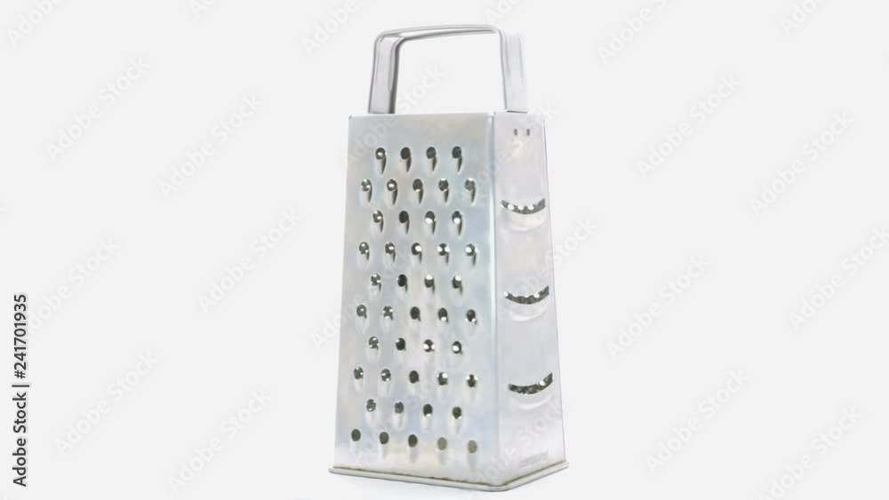 Metal grater isolated rotating on a white background. Kitchen equipment for cooking. Metal grater isolated rotating on a white background. Kitchen equipment for cooking.