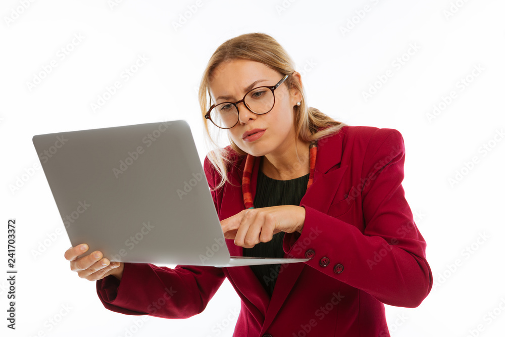 Serious young woman focusing on her work Serious young woman focusing on her work