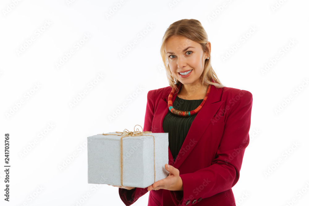 Cheerful pleasant woman giving you a present Cheerful pleasant woman giving you a present