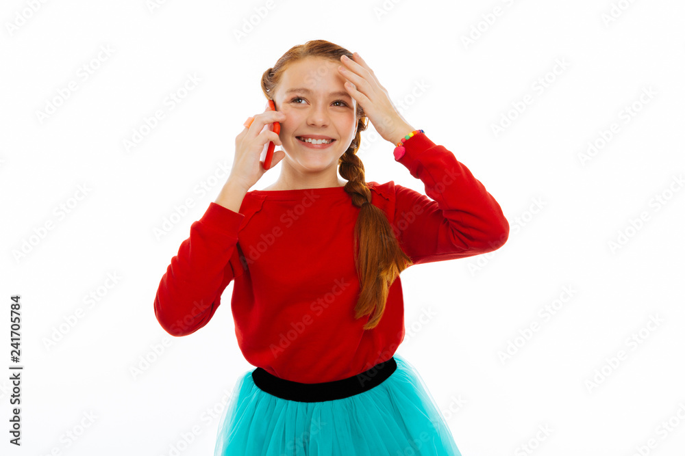 Cheerful nice girl having a pleasant conversation Cheerful nice girl having a pleasant conversation