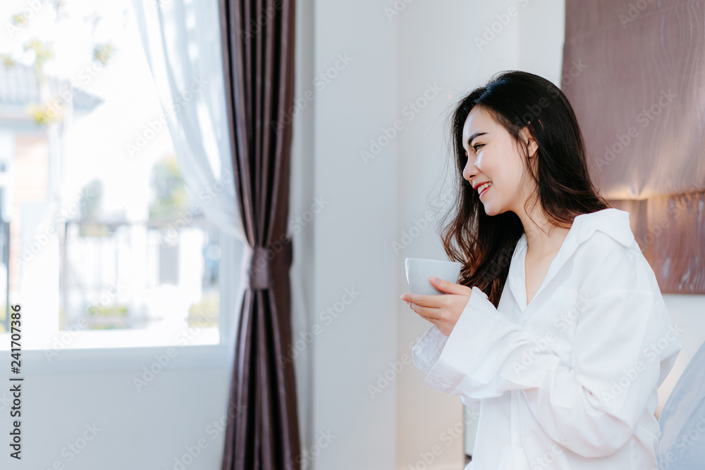 Asian woman drinking coffee in the morning breakfast in window bedroom fresh start the day happiness relax at home healthy lifestyle Asian woman drinking coffee in the morning breakfast in window bedroom fresh start the day happiness relax at home healthy lifestyle