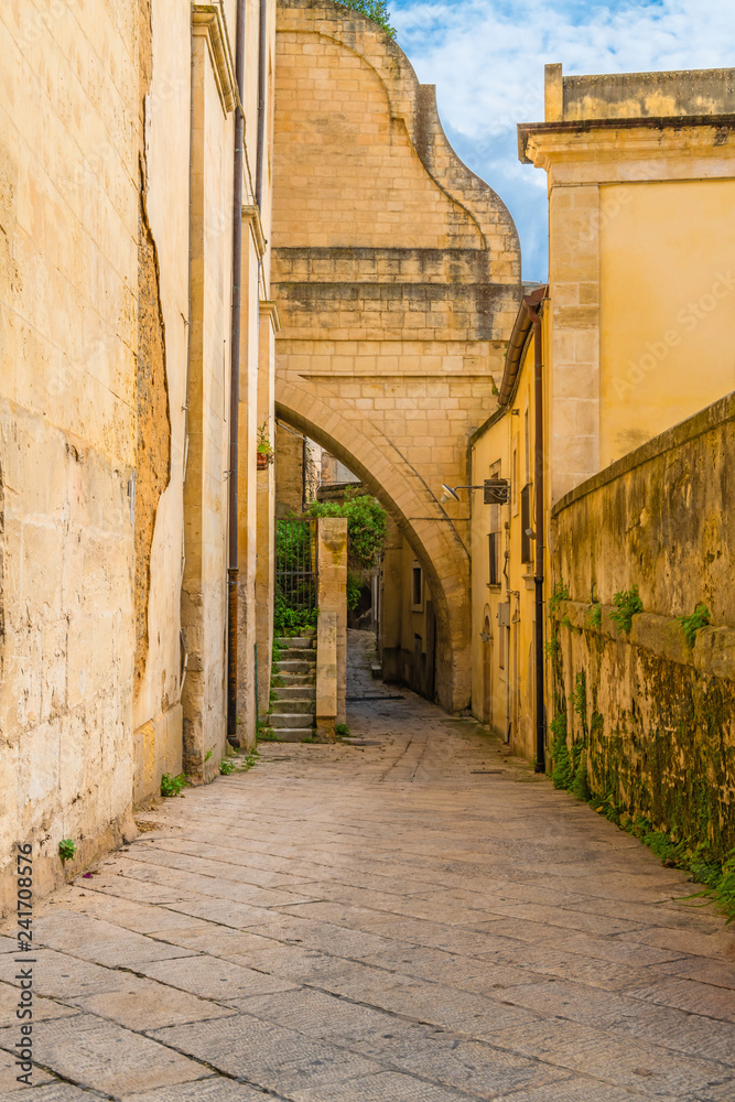 Italian archway street, Ragusa, Sicily, Italy