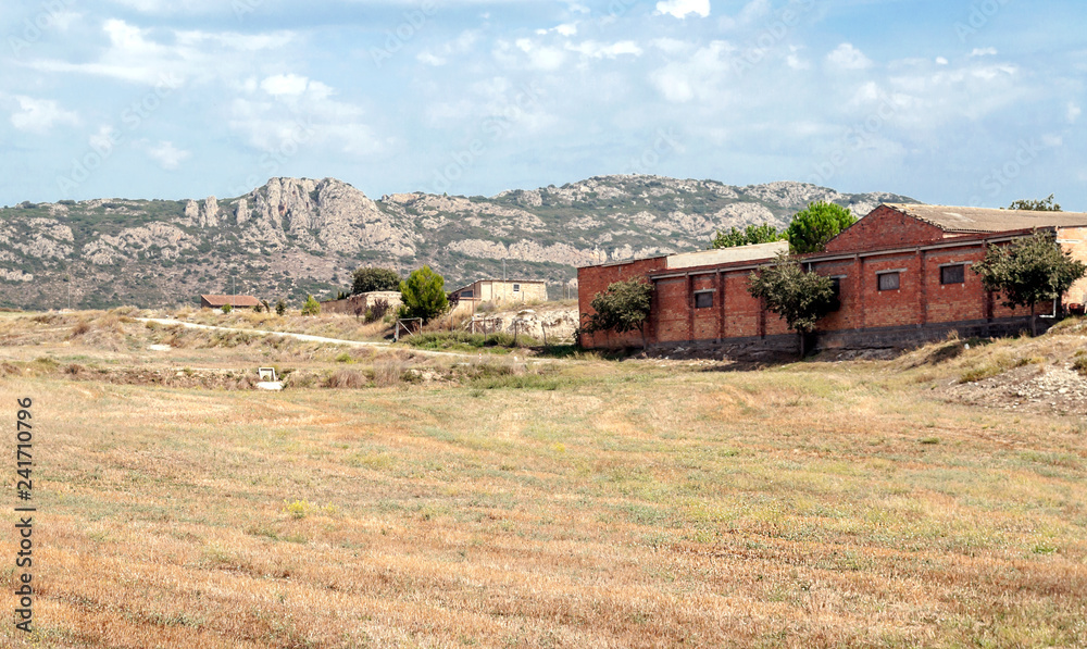 Rural village in Catalonia with the mountains of the Pyrenees in the background. Rural village in Catalonia with the mountains of the Pyrenees in the background.