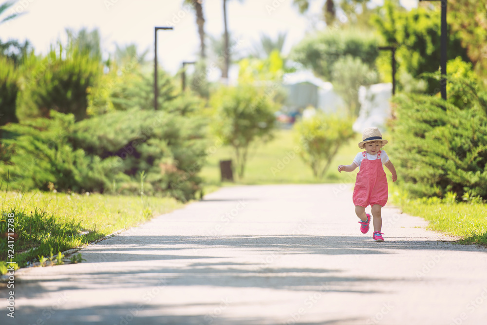 little girl runing in the summer Park little girl runing in the summer Park