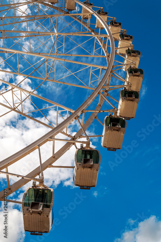 Ferris wheel turning in Andorra with the Pyrenees alond mountains