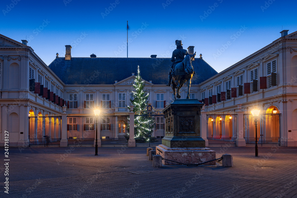 public square in front of Noordeinde Palace at dusk