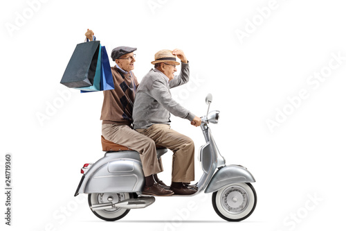 Two senior men riding a vintage scooter and holding shopping bags