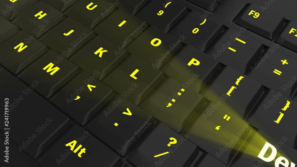 pointing the camera on yellow glowing Develop key on black computer keyboard pointing the camera on yellow glowing Develop key on black computer keyboard