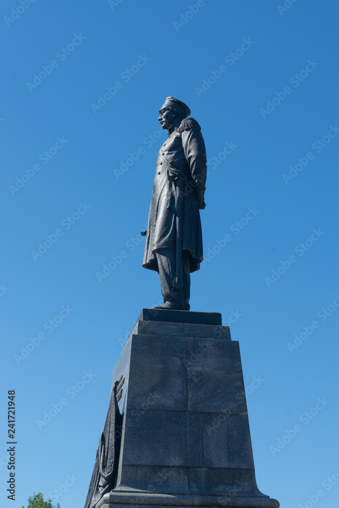Fototapeta premium Nakhimov monument in the Central square of the city against the blue sky.
