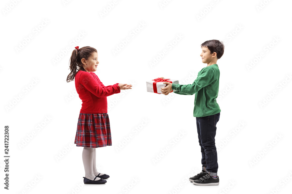 Little boy giving a wrapped present to a little girl Little boy giving a wrapped present to a little girl