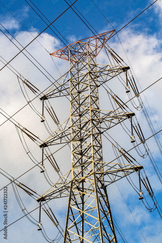 Electric pole, power plant with clouds in blue sky Electric pole, power plant with clouds in blue sky