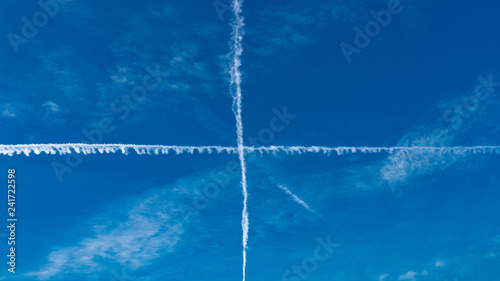 Sky subdivided  in 4 perfect square by jet trail photo