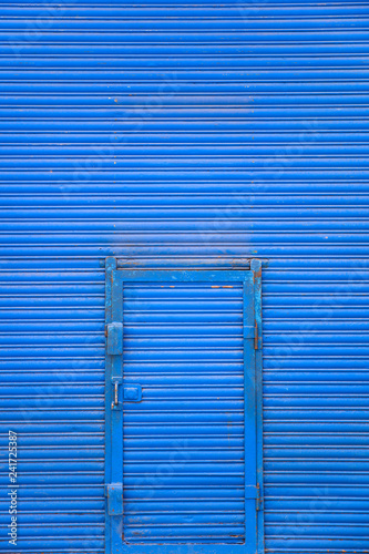Blue metal door on the blue...